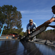 SolarCraft workers Joel Overly (L) and Craig Powell (R) install a solar panel on the roof of a home on February 26, 2015 in San Rafael, California.